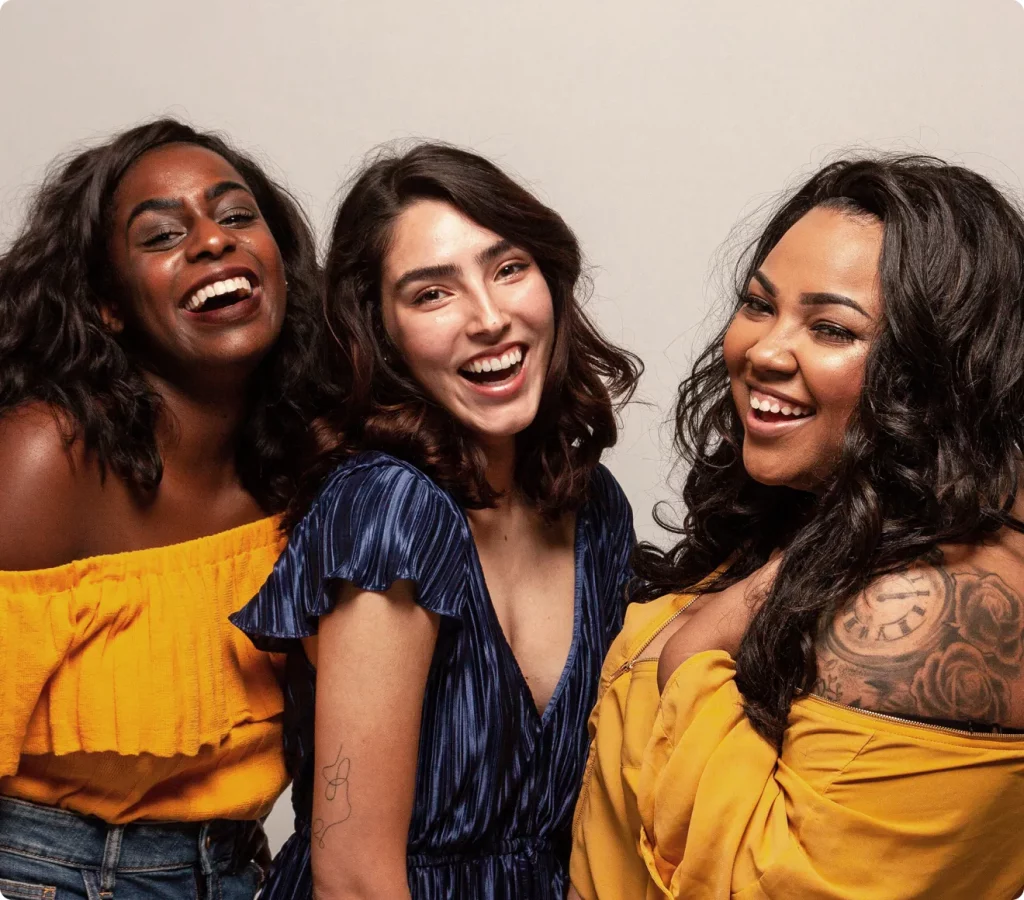 Three women laughing together